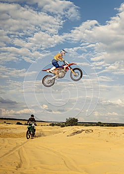 View from afar on jumping motocross rider