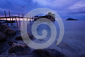 View from Agios Sostis and Cameo island with wooden bridge shot before sunrise . Zakynthos Greece.