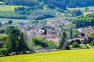 View on the agricultural fields with grain and houses in Bad Pyrmont in Germany