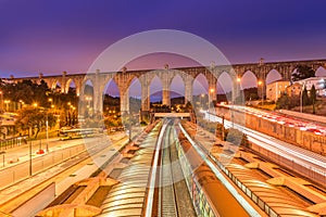 View of The Aguas Livres Aqueduct and Campolide train station, Lisbon, Portugal photo