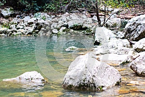 View of the Agur river with stone on Agur gorge