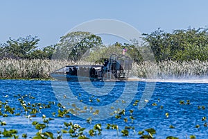 A view of an airboat in a channel in the Everglades, Florida