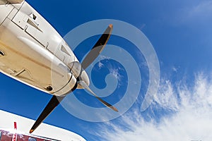 View of aircraft propeller blade and turboprop engines with blue