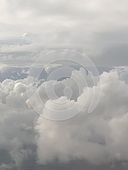 View from airplane above clouds