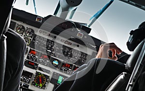 View of airplane cockpit and pilot