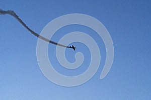 View of an airplane flying over the sky on a blue background on aviation and military day romania bucharest