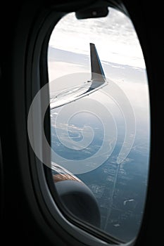 View from an airplane window outside at the wing