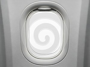 A view through an airplane window showcasing the sky and clouds