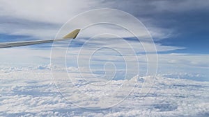 View from the airplane window showing skyline, clouds, beautiful forest, ocean, ships, mountains, islands and buildings