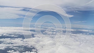 View from the airplane window showing skyline, clouds, beautiful forest, ocean, ships, mountains, islands and buildings