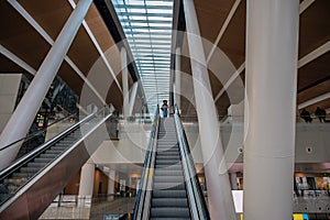 View of airport terminal moving staircase. Travel concept