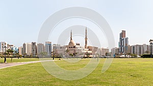 View from the Al Ittihad Park to the King Faisal Mosque in Sharjah city, United Arab Emirates