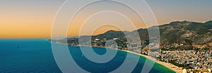 The view from Alanya Castle citadel in Turkey during sunrise or sunset. Panorama view of city