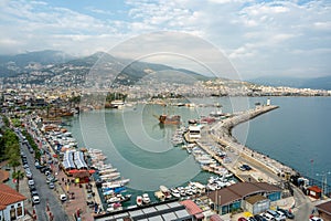 View of Alanya marina and walking path, one of the touristic districts of Antalya, from the Red Tower