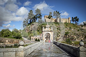 View of the Alcantara bridge with the San Servando castle in the background in Toledo