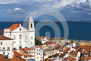 View of the Alfama Neighbourhood in Lisbon with the Tagus River in the background