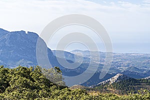View of the Alicante coast from the top of the Aitana mountain with photo