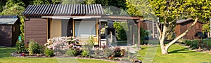 view into a allotment garden with a tiny house photo