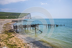 A view along the beach past sea defenses at Cuckmere Haven, UK