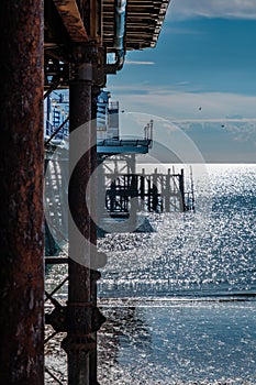A view along Eastbourne pier in early morning sunlight