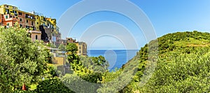 A view along the edge of the picturesque Cinque Terre village of Corniglia, Italy