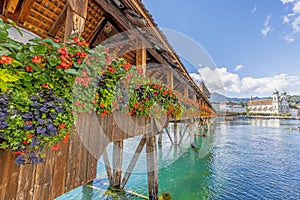 View along the flower-covered Chapel Bridge in Lucerne