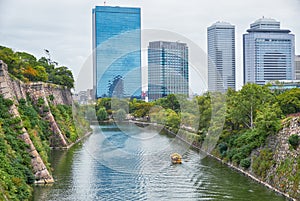 Inner moat of Osaka Castle with the Osaka Business Park on the background. Osaka. Japan photo