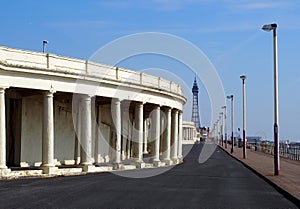 View along the promenade at blackpool showing the pedestrian walkway with old seafront shelters looking towards the pleasure beach