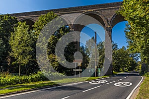 A view along the road passing underneath the Chappel Viaduct near Colchester, UK