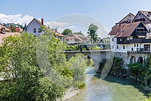 A view along the Selca Sora River in the town of Skofja Loka, Slovenia