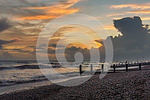 A view along the shore at Worthing, Sussex at sunset