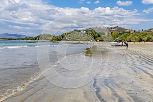 A view along the shoreline towards the settlement at Tamarindo in Costa Rica