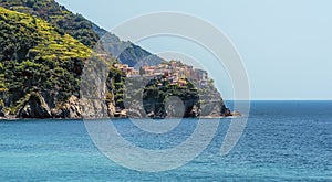 A view along the station platform and coastline at Corniglia, Italy