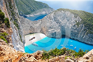 View along the steep cliffs to the famous shipwreck beach, Navagio, on Zakynthos island, Greece