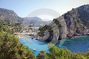 View of the amazing bay with beautiful crystal clear water and cliffs in Paleokastritsa, Corfu, Greece