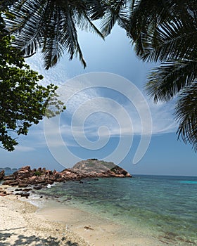 Corol reef rock landscape with a pure blue sky and a green clear water photo
