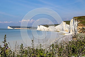 View of the amazing Seven Sisters white chalk cliffs in the county of Sussex, England.