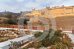 View of Amber fort and palace from Kesar Kyari Bagh garden on Maotha Lake. Rajasthan. India