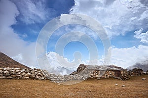 A View of Amphu Gyabjen and Ama Dablan peaks with Old Stone Hut, Everest base camp trek, Nepal photo