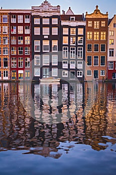 View of Amsterdam houses on the Amstel calan reflecting in the water