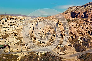 View of ancient cave houses of small town Cavusin in Cappadocia