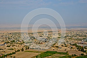 View of ancient city of Jericho from the mountains of temptation. Horizontal photo of the city of pilgrims