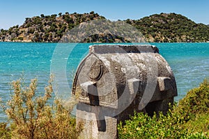 View of ancient Lycian sarcophagus tombs on a mountain near Kekova, lying on a Lycian way. Turkey.