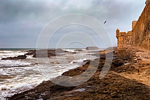 View of the ancient medieval walls on the Atlantic Ocean coast. Essaouira, Morocco