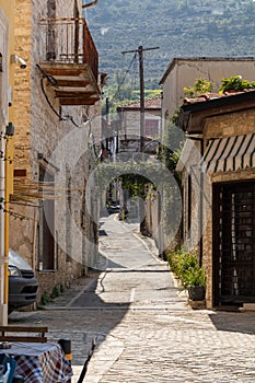 View of an ancient narrow street of an old town on a sunny day. Lefkara, Cyprus