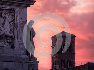 View of the ancient sculpture on the building, sunset, Rome, Italy