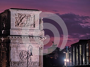 View of the ancient sculpture on the building, sunset, Rome, Italy