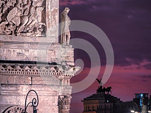 View of the ancient sculpture on the building, sunset, Rome, Italy