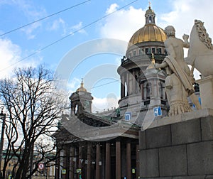 View of the ancient statues of stucco and the dome of St. Isaac's Cathedral Petersburg