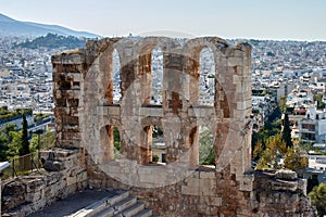 view of the ancient stone arches of the ruins of the Odeon Theater of Herodes Atticus on the Acropolis of Athens